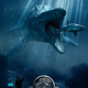 Illustration for article titled Mosasaurus Grabs A Shark Snack In Latest iJurassic World/i Poster
